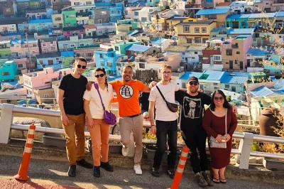 Wake up to busan’s colors on a small group tour—walk gamcheon culture village, taste at jagalchi fish market, and ride along diamond bridge. includes pickup.