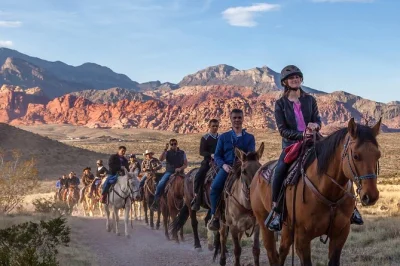 Feel the desert air on a sunset horseback ride in red rock canyon, spot wildlife, then share a campfire bbq dinner. includes pickup and local guide.