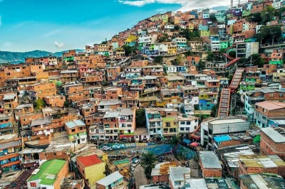 Walk medellin’s comuna 13 with a local guide, taste street food like mango ice cream and empanadas, ride the famous escalators, and hear powerful stories.