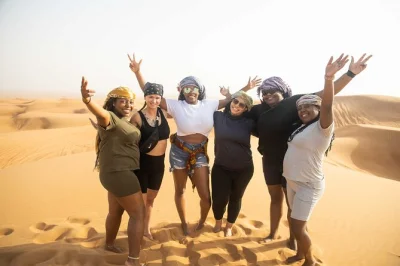 Start your morning in dubai with dune bashing, sandboarding, a camel ride, and falcon photos. includes hotel pickup, cold drinks, and a local guide for a lively desert escape.