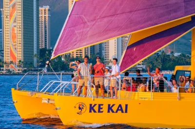 Feel the breeze on waikiki beach as you sail past diamond head, sip cocktails, and catch a hawaiian sunset. includes drinks, music, and local crew on board.