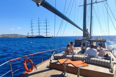 Sail from mykonos to delos & rhenia, explore ancient ruins, swim in blue coves, and share a bbq lunch on board. includes drinks, snorkeling gear, and optional pickup.