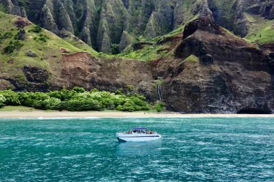 Feel the salt spray as you explore kauai’s na pali coast by power catamaran, with sea caves, snorkeling, and fresh hawaiian fruit. includes gear and small group.