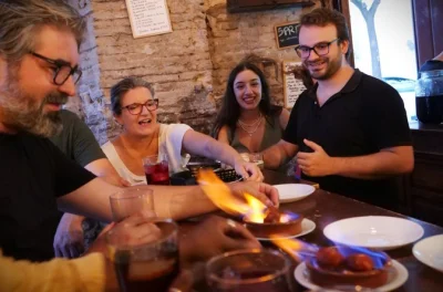 Wander seville’s old neighborhoods tasting jamón, pork cheeks, and chorizo cooked in flames, with a local guide. includes ice cream finale and all tastings.