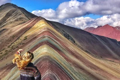 Arrive at rainbow mountain after the crowds, hike with a local guide, and share a picnic lunch overlooking the andes. includes hotel pickup and all entry fees.