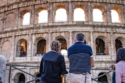Feel the thrill of stepping onto the colosseum arena floor, explore the roman forum and palatine hill with a certified guide. includes entry tickets and headset.