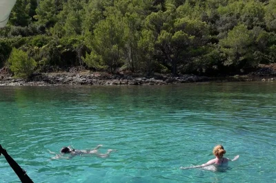 Feel the sea breeze on a zadar boat tour to ugljan, galevac & osljak with swimming, snorkeling, monastery visit, and local drinks—includes refreshments & gear.