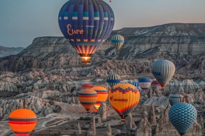 Float over cappadocia’s fairy chimneys with flexible hot air balloon flights. includes hotel pickup, up to four valley options, and non-alcoholic champagne toast.