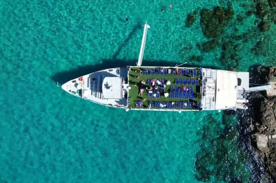 Feel the splash at malta’s blue lagoon, cruise comino’s caves, and relax on deck chairs. includes slide access, shaded seating, and onboard bar.