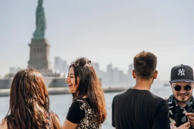 Feel the buzz of new york bay, ferry to liberty island, explore ellis island stories, and walk with a local guide. includes reserved tickets and audio guide options.