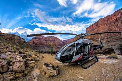 Feel the rush of a grand canyon helicopter flight from las vegas, land deep inside the canyon for a champagne toast, and return flying above the strip. includes hotel pickup.