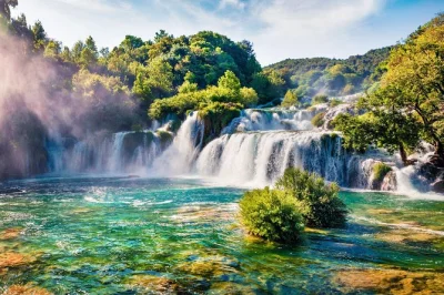 Feel the spray at krka’s waterfalls, cruise to skradin, swim in the river, and taste local wine—all with a guide and transport from split or trogir included.