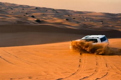 Feel the rush of a qatar desert safari with dune bashing, camel rides, sandboarding, and a visit to the inland sea. includes hotel pickup and local guide.