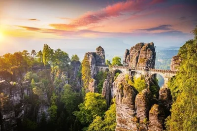 Feel the wild sandstone cliffs of bohemian & saxon switzerland, cross bastei bridge, and hike to pravcicka gate on a small-group day trip from prague with lunch included.