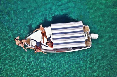 Feel the breeze on a private elafiti islands boat trip from dubrovnik—swim in blue caves, wander koločep’s port, relax at Šunj beach. includes pickup & drinks.