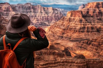 Start your day with las vegas’ iconic sign, wander the surreal seven magic mountains, walk atop hoover dam, and explore grand canyon west rim—includes pickup & snacks.