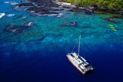 Start your morning sailing kona coast, spot dolphins, snorkel kealakekua bay’s reefs, and share stories with a native hawaiian crew. includes breakfast & lunch.