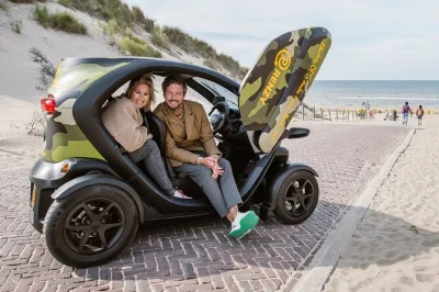 Feel the wind in a 2-person electric twizy as you explore south holland’s dunes, beaches, and villages with gps audio. includes stops, photos, and flexible pace.