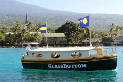Watch tropical fish glide beneath your feet on a glass-bottom boat tour in kailua-kona, big island. includes live marine guide, drinks, and easy pier boarding.