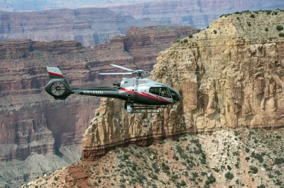 Feel the rush of a grand canyon helicopter flight from tusayan, soaring above kaibab forest, painted desert, and dragon corridor. includes all fees.