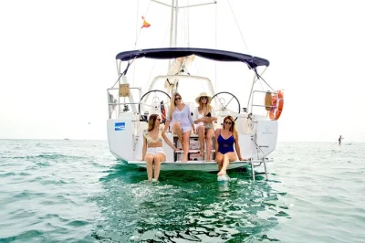 Feel the sea breeze on a private barcelona sailing trip, with open bar, snacks, and a chance to swim. small group tour departs from port olímpic with local skipper.