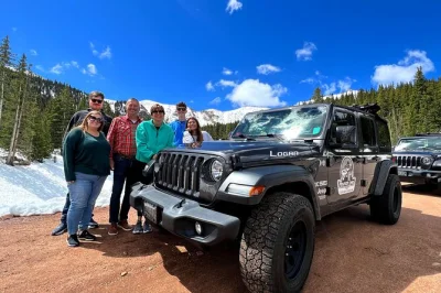 Feel the altitude shift on a small-group jeep tour up pikes peak, with stories from local guides, stops for photos, and time at the summit—entry fees included.