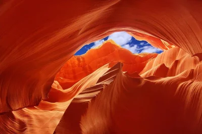 Step into lower antelope canyon’s winding sandstone with a navajo guide, smaller groups, and ladders down to hidden chambers—entry fees included for easy booking.