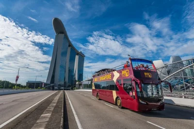 Feel the breeze atop an open bus in singapore, explore chinatown & gardens by the bay, enjoy audio in 7 languages, and catch a live-guided night tour with pickup.