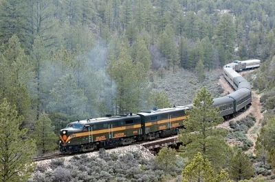 Ride the historic grand canyon railway from sedona, explore south & east rims with a guide, and visit cameron trading post. includes hotel pickup & water.