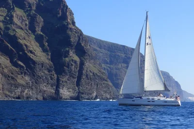 Feel the sea breeze as you sail tenerife’s los gigantes cliffs, spot dolphins and whales, swim in a quiet cove, and enjoy drinks and sandwiches with a small group.