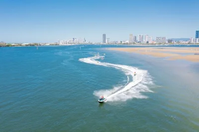 Feel the spray on a 30-minute jet ski safari from gold coast, weaving past wave break and crab island with a local guide. includes safety gear, waterproof storage, and family-friendly fun.