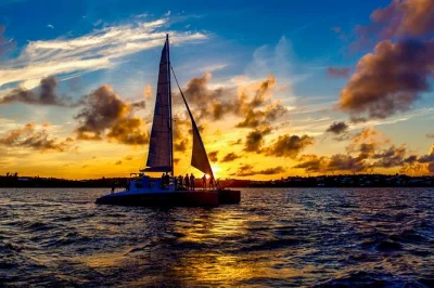 Feel the breeze on a bermuda sunset cruise with fresh-baked cookies, unlimited rum swizzles, music, and local stories. includes drinks and pickup options.