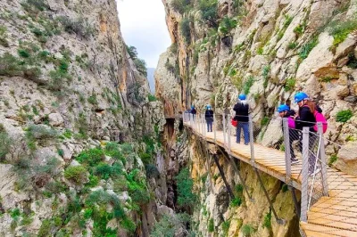Feel the thrill of caminito del rey on a guided day trip from malaga with pickup, premium bus, entry ticket, and time to walk the gorge at your own pace.
