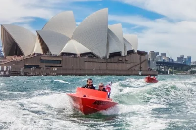 Feel the spray as you captain your own red speed boat on sydney harbour, pass the opera house, harbour bridge, and shark island—guided, with all gear included.