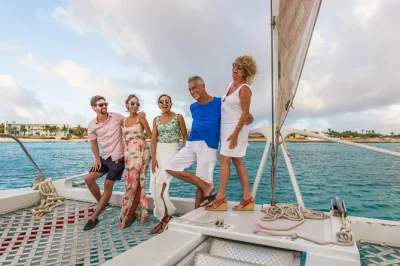Watch aruba’s sunset from a catamaran, enjoy a caribbean buffet dinner, sip cocktails from the open bar, and unwind to live music—includes pier boarding.