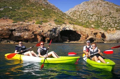 Feel the sea air on a guided kayak trip from dénia to cova tallada, explore the ancient cave by lantern, snorkel in the marine reserve, and enjoy snacks before paddling back.