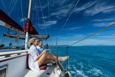 Sail the whitsunday islands on lady enid, snorkel vibrant reefs, relax at whitehaven beach, and enjoy gourmet meals with adult-only comfort. includes pickup and lunch.