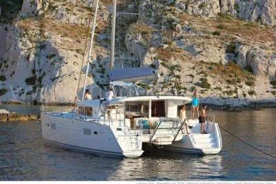 Step onto a luxury catamaran from porto rafael & palau to the maddalena archipelago, with stops for swimming, snorkeling, sardinian lunch, and local wine included.