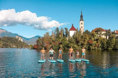 Paddle lake bled with a small group, learn sup basics from a local guide, reach bled island, play games, and relax on the water. includes all equipment and photos.