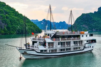 Wake up on ha long bay, kayak luon cave, play volleyball on titop island, and join a sunset party—all with pickup from hanoi and overnight on the oasis bay cruise.