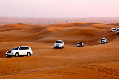 Feel the thrill of dubai’s desert with dune bashing, camel rides, and a bbq dinner show. includes hotel pickup, live entertainment, and traditional activities.