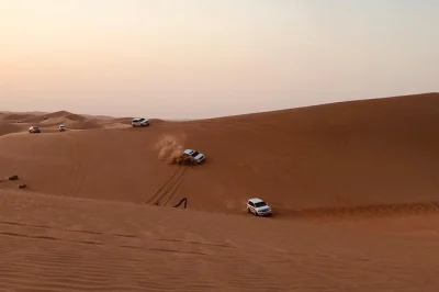 Experience a real abu dhabi desert safari: dune bashing, camel ride, sandboarding, bbq dinner, and live shows. book your arabian adventure now.
