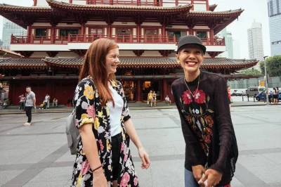 Experience singapore at night with a private city tour. see chinatown, buddha tooth relic temple, taste satay, and catch the spectra light show.