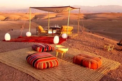 Experience a sunset camel ride and moroccan dinner in agafay desert near marrakech. includes transport, mint tea, and local cuisine under the stars.