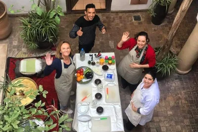 Join a marrakech cooking class in a riad, shop at a local souq, visit the communal oven, and cook authentic moroccan dishes with expert guidance.