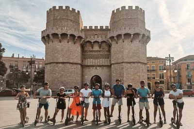 Explore valencia by e-scooter with a private guide. visit turia gardens, city of arts & sciences, serranos towers, and the beach in one fun tour.