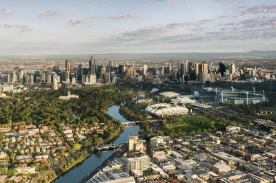 Float over melbourne at sunrise by hot air balloon, spotting city icons before a relaxed champagne breakfast. includes pickup, local guide, and all transport.