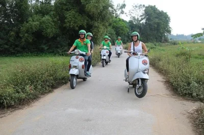 Ride vintage vespas from hanoi to the red river delta, visit ancient villages, meet local farmers, and enjoy a homegrown lunch. book now with hotel pickup.
