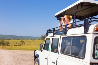 Wake up to lions in serengeti, meet maasai near ngorongoro, and track rhinos in the crater—private safari with lodge nights, all fees, and binoculars included.