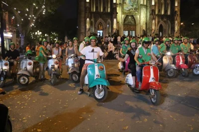 Ride vintage vespas through hanoi’s lively streets, taste secret local dishes, watch the train pass by, and end with live music. includes pickup & guide.